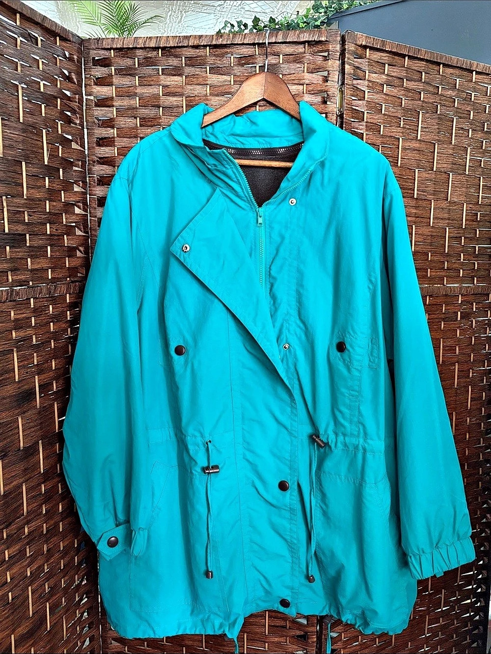 Woman Within Teal Jacket